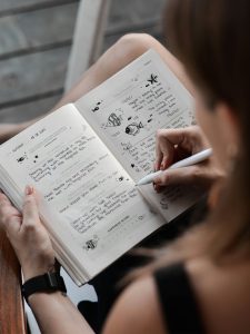 woman doodling in a journal