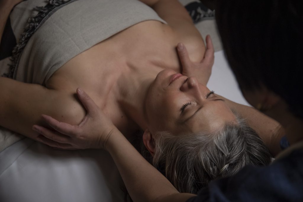 Woman receiving a shoulders massage