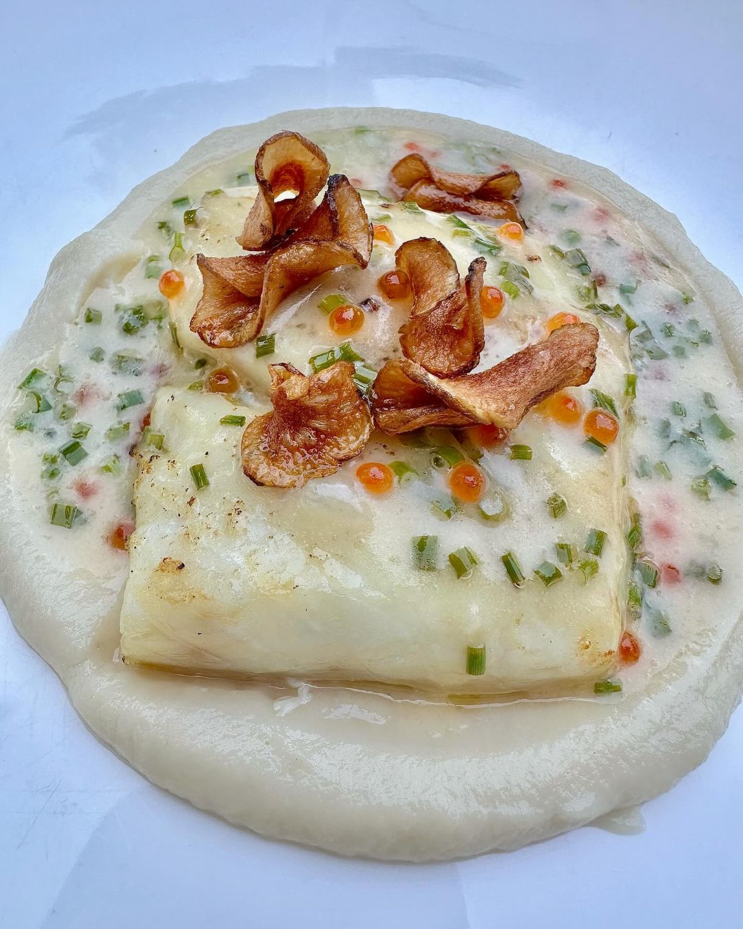 halibut with trout roe, chive beurre blanc and sunchoke purée